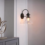 GLOBE Electric 44661 Torrent 1-Light Outdoor Wall Sconce, Black, Seeded Glass Shade, 60W Vintage Edison | Lumora