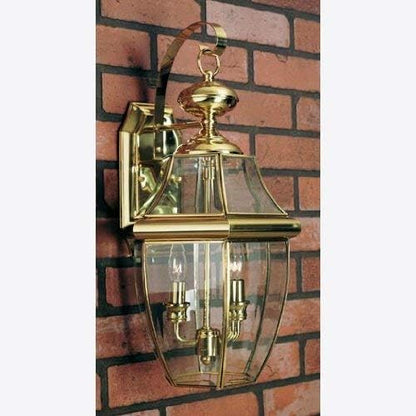 Quoizel Newbury Outdoor Wall Lantern, 20 Inch 2-Light Polished Brass Wall Sconce, French Country Exterior Wall Lantern Fixture, E12 Base, Clear Glass, Outside Lights for Patio, Porch, Garage or Yard