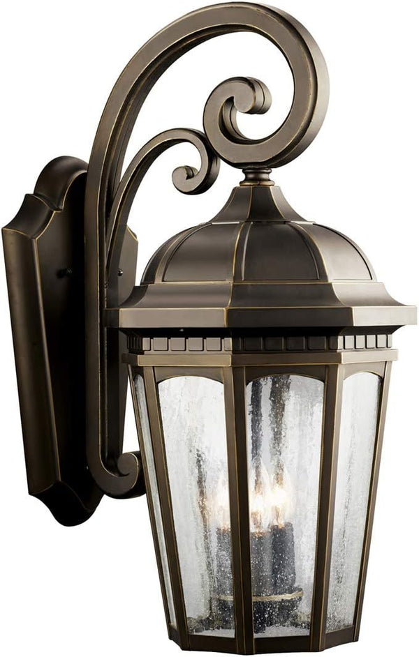 Kichler Courtyard 3-Light Outdoor Wall Light in Rubbed Bronze Finish with Clear Seeded Glass Shades for Porch | Lumora
