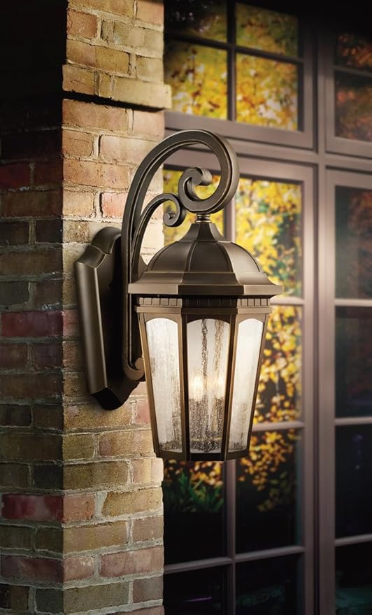 Kichler Courtyard 3-Light Outdoor Wall Light in Rubbed Bronze Finish with Clear Seeded Glass Shades for Porch | Lumora