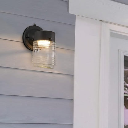 Maxxima Outdoor Wall Lantern Light Fixture, Enclosed Clear Ribbed Glass Jelly Jar Exterior Light, Black Finish, Dusk to Dawn Sensor, 800 Lumens, Photocell Sensor, 3000K Warm White