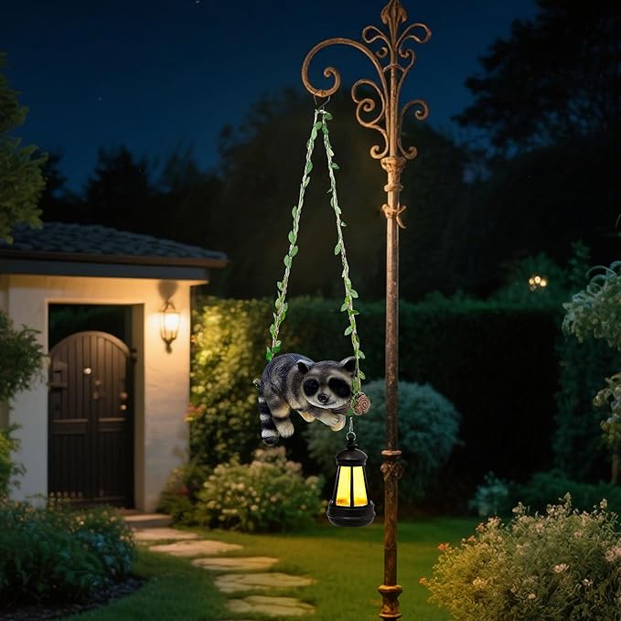 Solar Lighted Garden Outdoor Statue, 20.1" H Hanging Swing Lying with A Sleeping Raccoon and A LED Lantern, Resin | Lumora