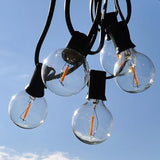 Hometown Evolution, Inc. G50 2" LED Filament Outdoor Patio String Lights with 0.6 Watt Light Bulbs (G50 LED - Black | Lumora