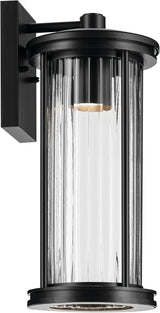 Kichler Barras 16" 1-Light Outdoor DarkSky Approved Wall Sconce with Clear Ribbed Glass in Black, Vertical Mount | Lumora