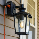 Home Luminaire 31703 Spence 1-Light Outdoor Wall Lantern with Seeded Glass and Built-in GFCI Outlet, Black | Lumora