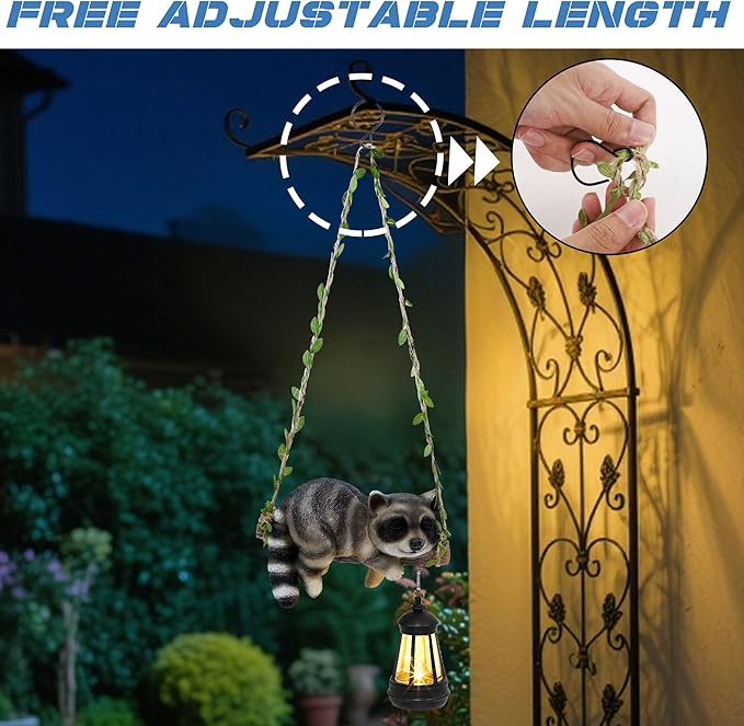 Solar Lighted Garden Outdoor Statue, 20.1" H Hanging Swing Lying with A Sleeping Raccoon and A LED Lantern, Resin | Lumora
