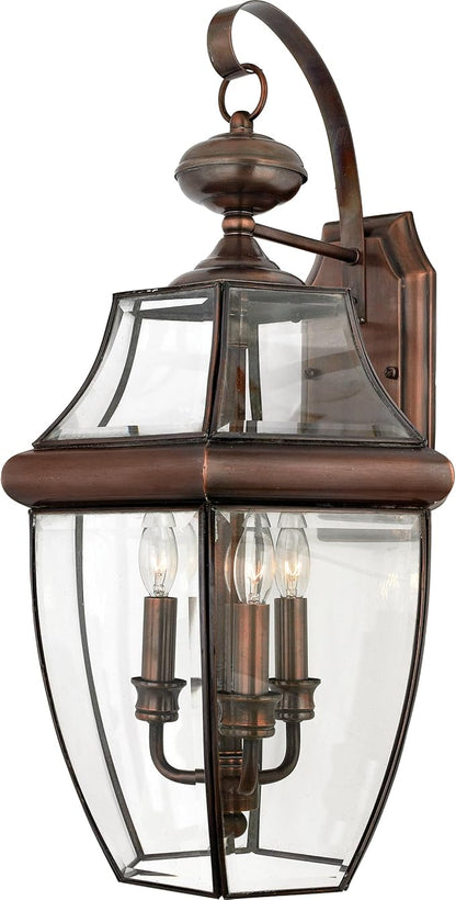 Quoizel Newbury Outdoor Wall Lantern, 23 Inch 3-Light Aged Copper Wall Sconce, French Country Exterior Wall Lantern Fixture, E12 Base, Clear Glass, Outside Lights for Patio, Porch, Garage or Yard