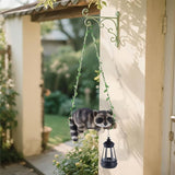 Solar Lighted Garden Outdoor Statue, 20.1" H Hanging Swing Lying with A Sleeping Raccoon and A LED Lantern, Resin | Lumora