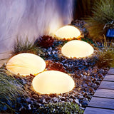 SUNNYPARK Solar Garden Lights Outdoor Set of 4 Plastic Pebble Shape Decorative Rock Lights Waterproof - Warm White | Lumora
