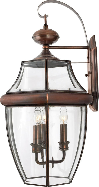 Quoizel Newbury Outdoor Wall Lantern, 23 Inch 3-Light Aged Copper Wall Sconce, French Country Exterior Wall Lantern Fixture, E12 Base, Clear Glass, Outside Lights for Patio, Porch, Garage or Yard