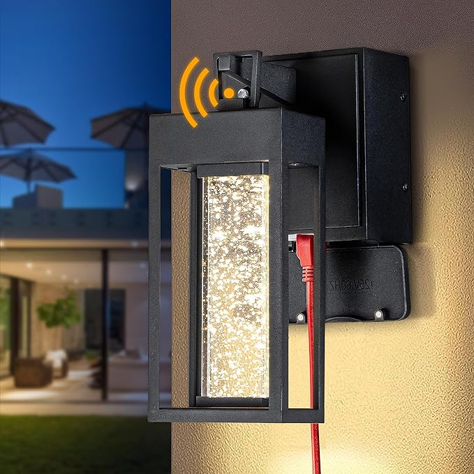 ALOADECOR 1 Light LED Modern Matte Black Dusk to Dawn Sensor Outdoor Wall Lantern Coach Sconces with Seed Glass and Built-in 2 GFCI Outlets Exterior Wall Mount Light for Garden Patio Front Door